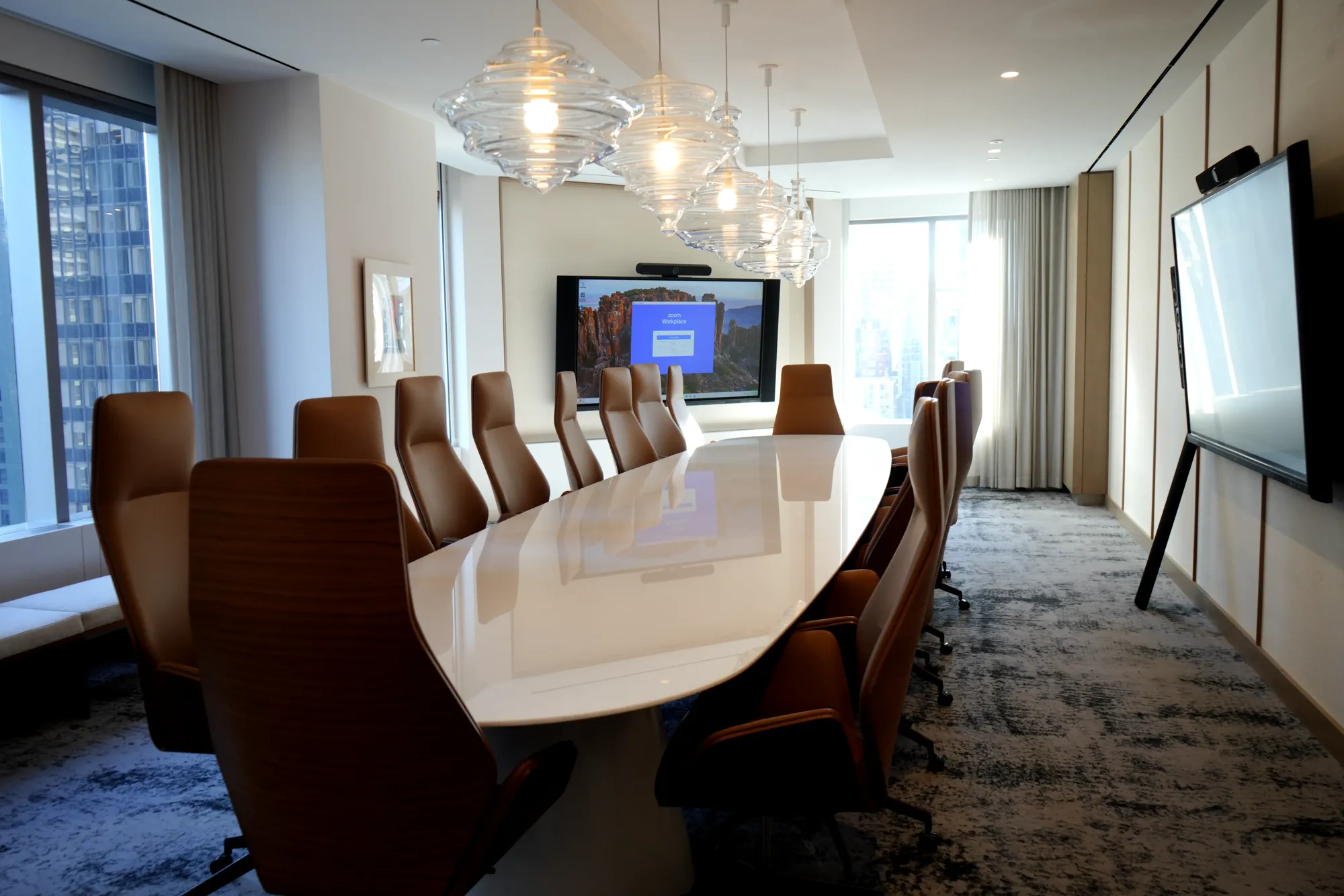 Boardroom with a display and video bar installed by DIST