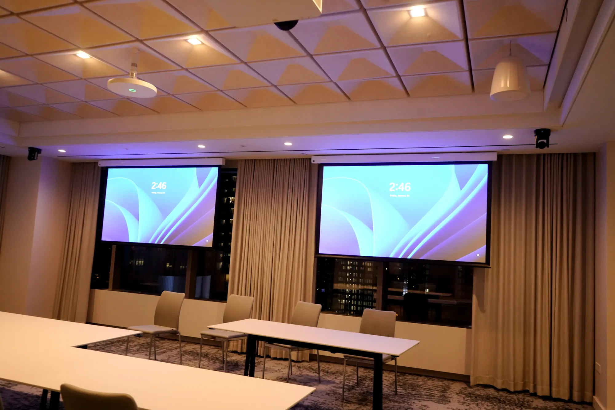 Dual projection screens in a 3 Times Square meeting room
