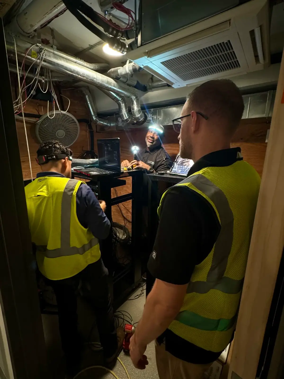 DIST field team programming systems at an equipment rack