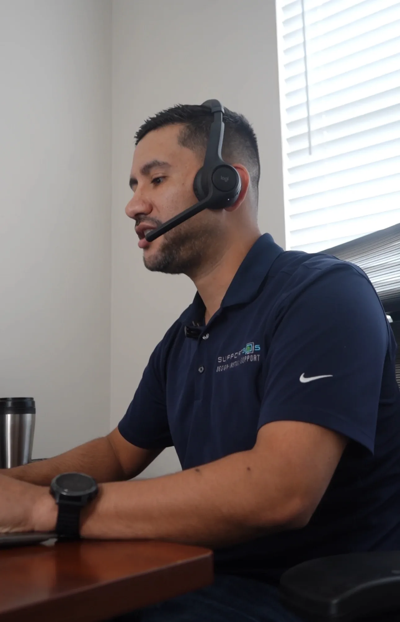 DIST help desk engineer on a headset supporting a Microsoft 365 user