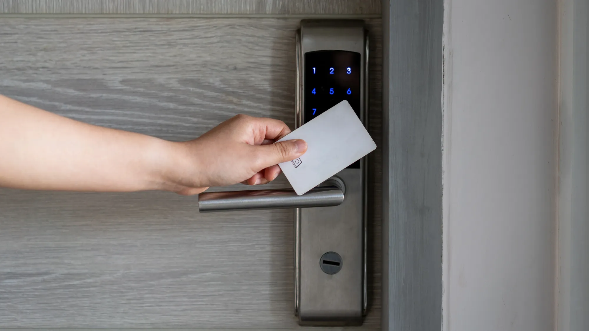 Keycard being tapped on a smart door lock