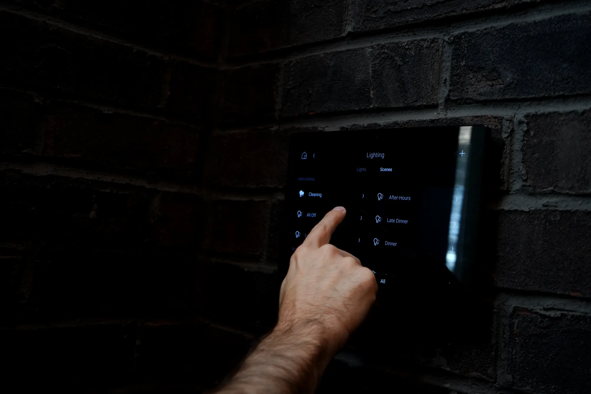 Wall keypad controlling lighting scenes
