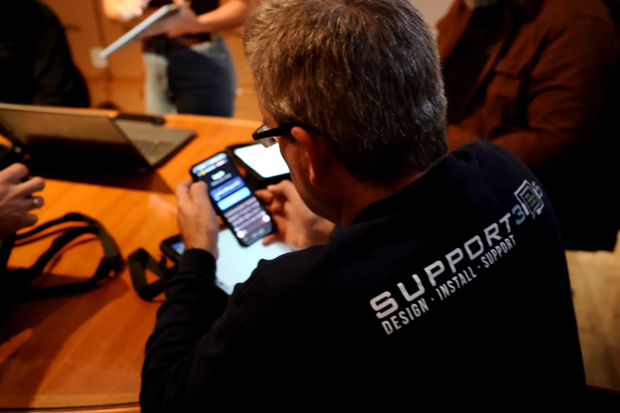DIST technician checking a system from a phone
